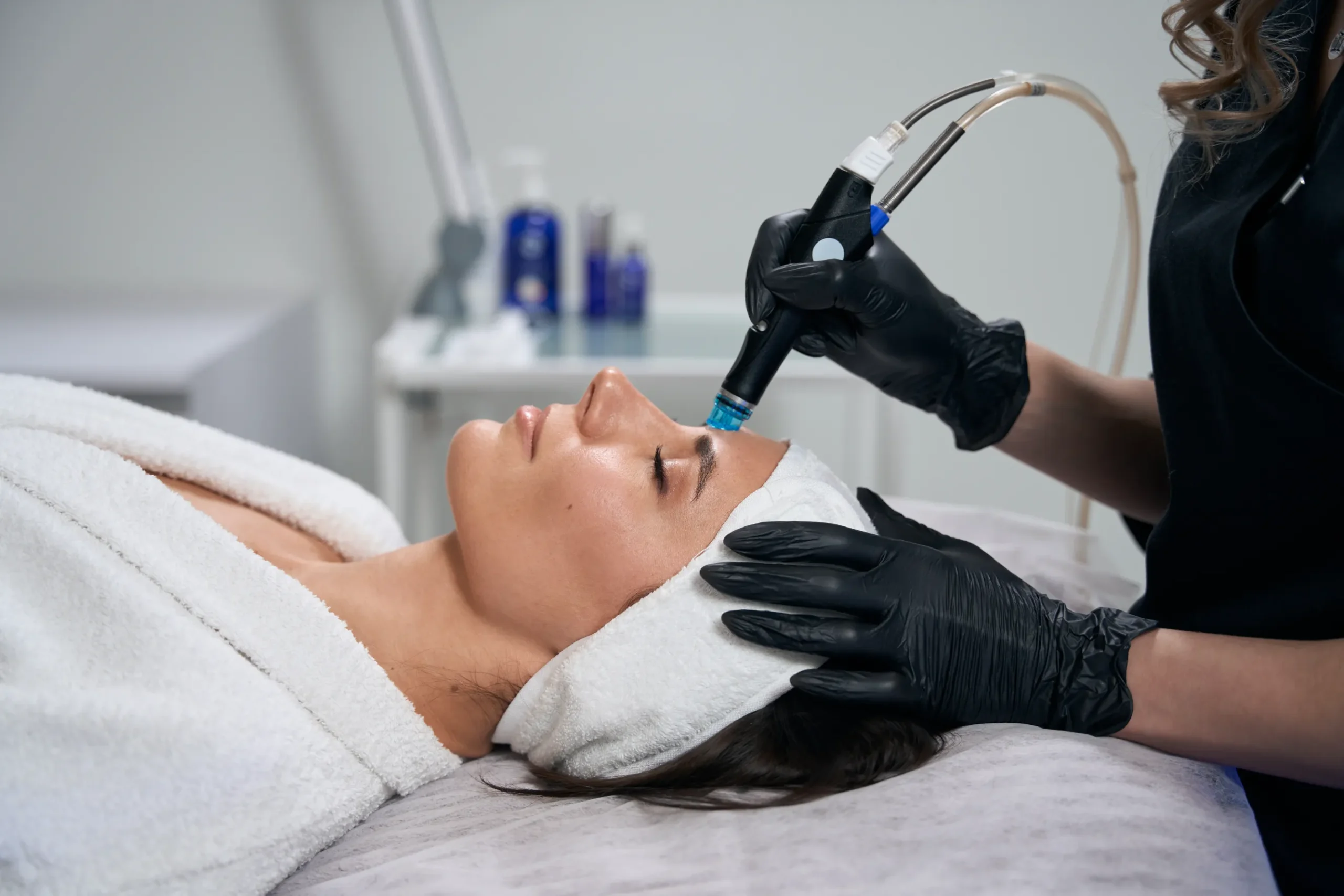 Hydrafacials removing excess oil and debris from clogged pores.