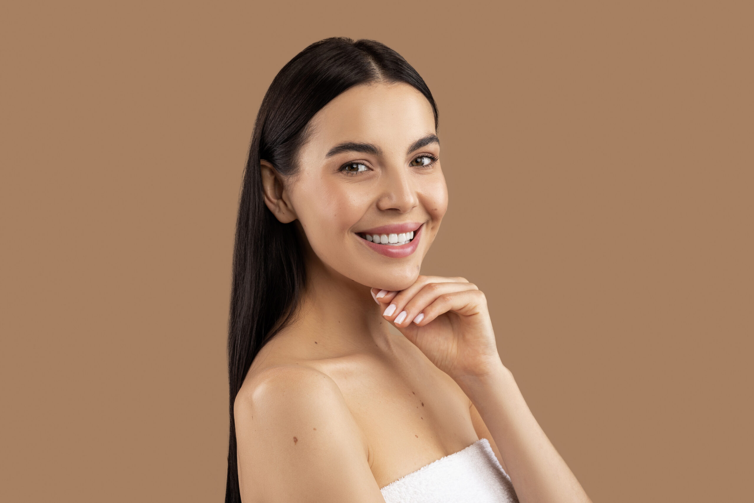 Smooth glowing skin after dermaplaning facial results.